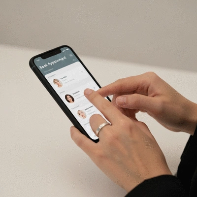 Person booking a spray tan appointment on a smartphone
